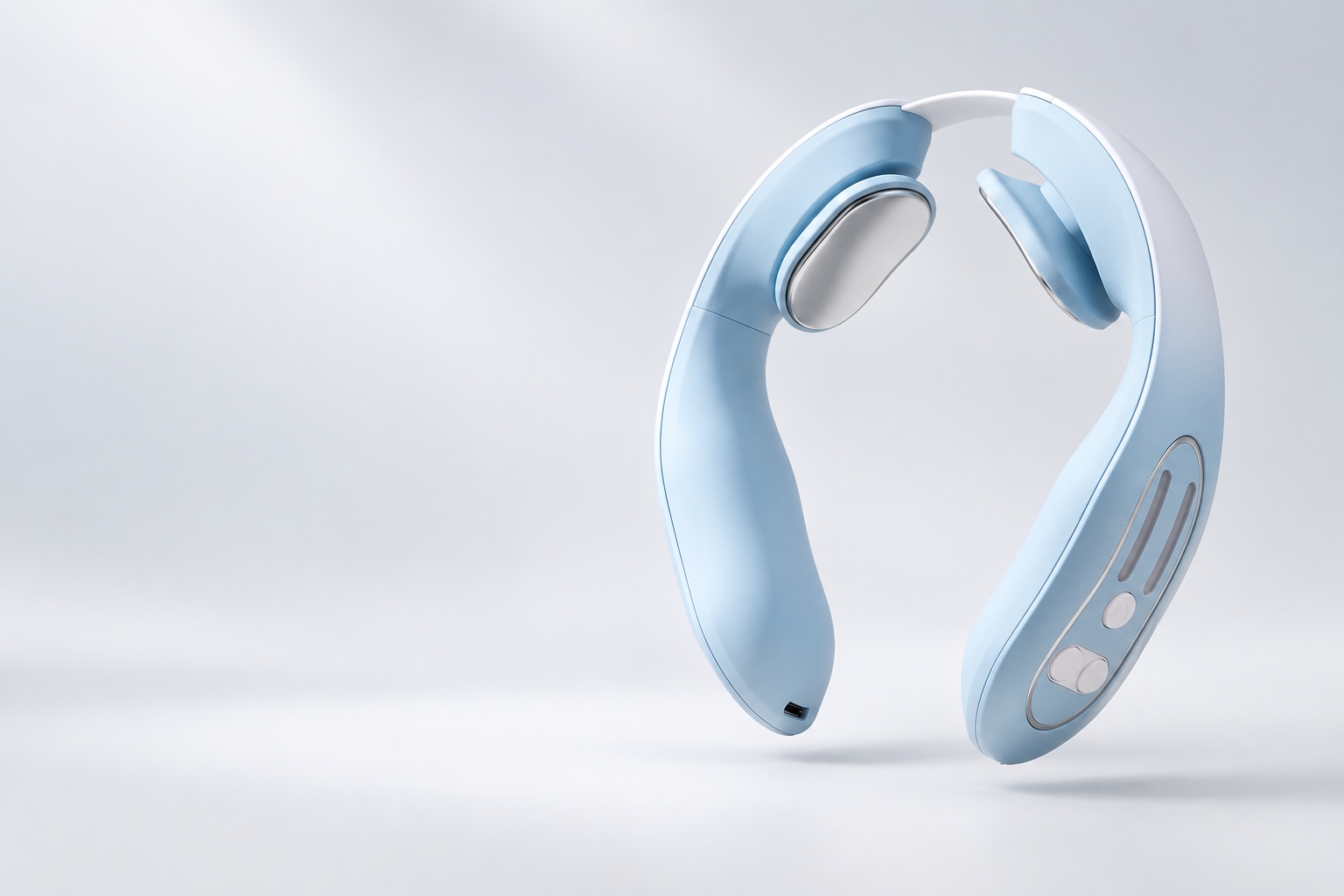 Verta's ice-blue wearable neck collar, with silver contact pads and side controls